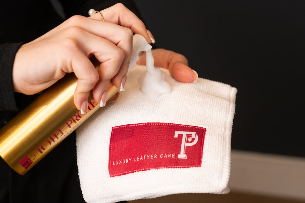 Totel Protect leather cleaner being applied to a branded microfibre cloth